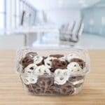32 oz RPET Plastic Tamper-Evident/Resistant Container with Flat Lid With Chocolate covered pretzels in container