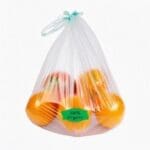 100% organic sticker on bag of oranges