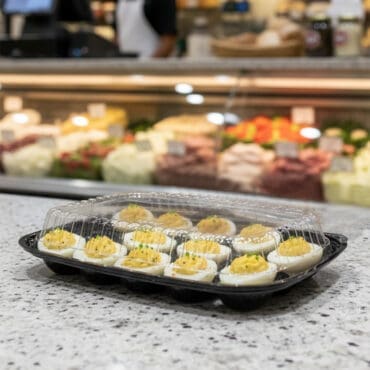 12 Count Disposable Deviled egg container on deli countertop