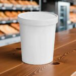 32oz paper cup for soups and other foods on a deli counter with lid on