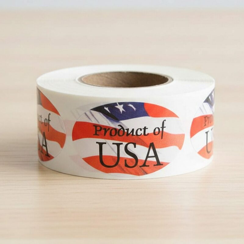 500467-Product-of-the-USA-Label-Stickers-with-Flag-Design Product of the USA sticker on a roll of labels with a flag design in the background oval