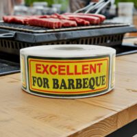 excellent for barbecue sticker on a yellow, red, and black butcher label