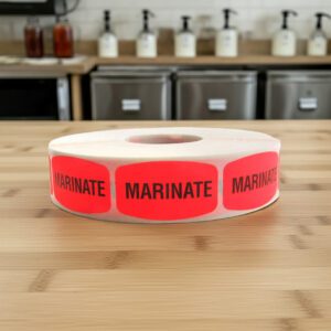 marinate stickers on a roll of red labels with black print