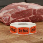 arm roast label on a small red label with black text reading arm roast