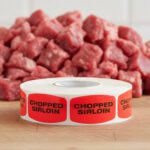 chopped sirloin stickers on a roll of red labels with black print