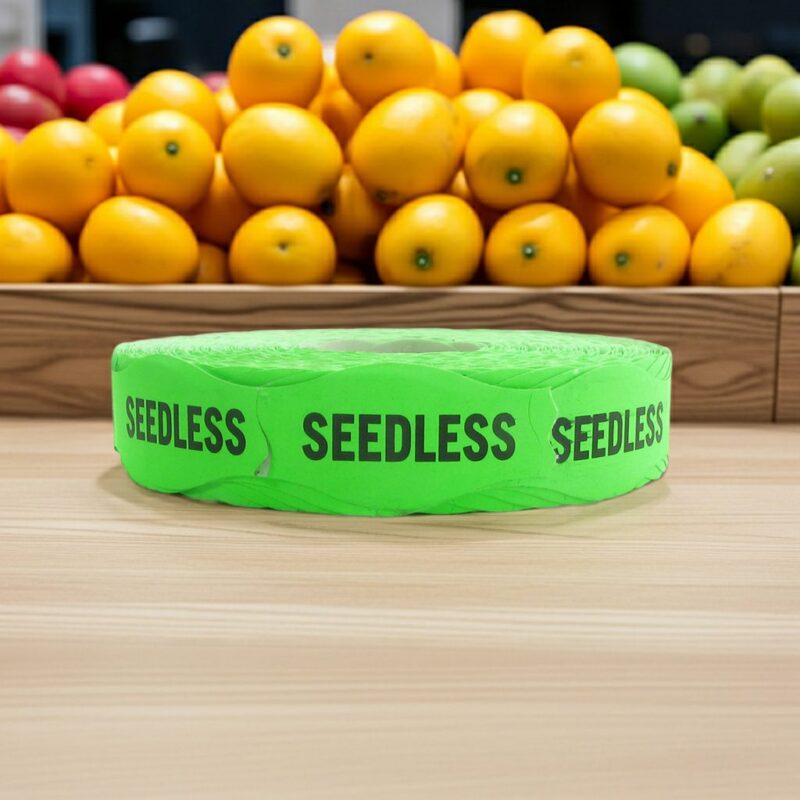 seedless green sticker on a roll of labels