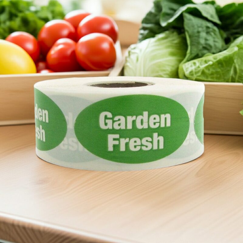 Garden Fresh sticker on an oval green label with white print with fresh produce behind it