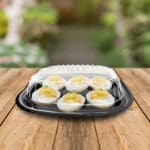 Deviled egg tray 6 count in use on a picnic table