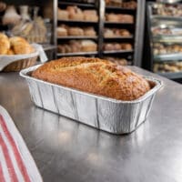 Loaf pan with bread inside