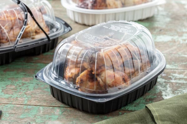 take out chicken roaster with chicken pictured inside carry out container