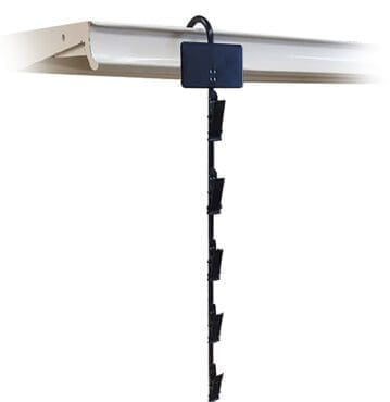 Merchandising clip strip on shelving unit