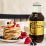 Wesley's 16oz Maple Syrup in use on a breakfast table with pancakes