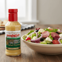 Caniglia’s Sweet Italian Dressing next to salad