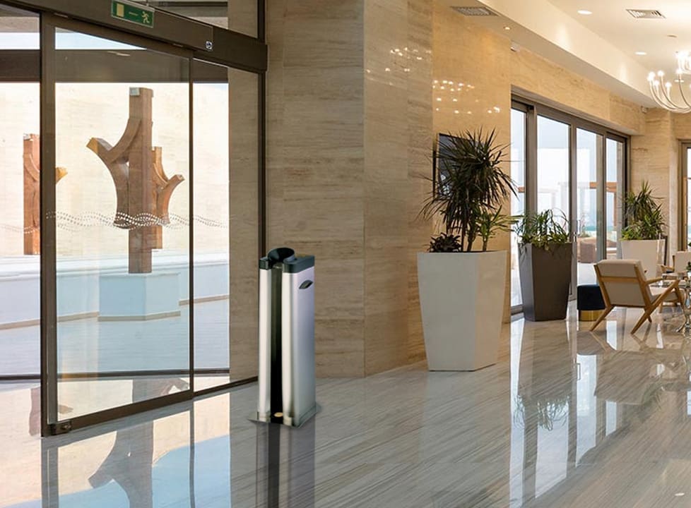 Single wet umbrella dispenser in lobby stainless steel