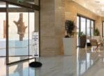 Wet Umbrella bag in a lobby