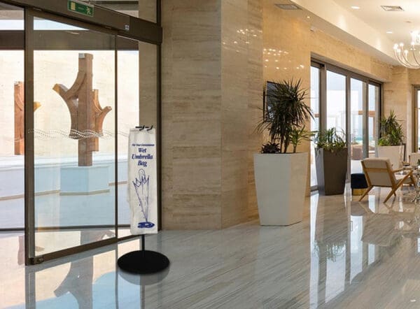 Wet Umbrella bag in a lobby