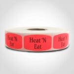 heat n eat label with red background on roll of stickers