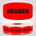 Reuben Label Dayglo Red Sticker on a roll of 1000 permanent adhesive