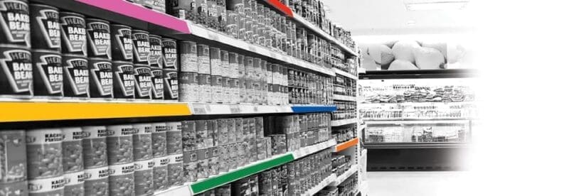 Colored molding strips in use on retail shelving