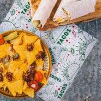 Taco Paper Wrap with tacos and nachos sitting on liner