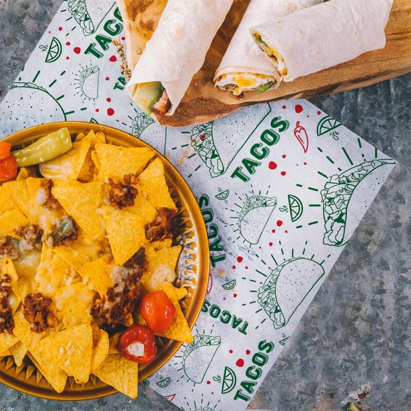 Taco Paper Wrap with tacos and nachos sitting on liner