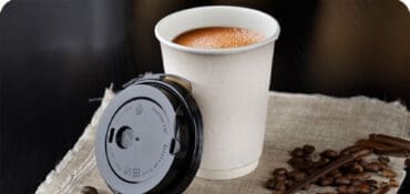 Disposable Paper Coffee Cup sitting on a table