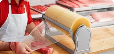 Wholesale Meat Film wrapping meat in a butcher shop