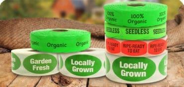 Produce Stickers like locally grown and organic label rolls sitting on a table