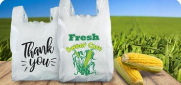 Corn Bag and Thank you carryout bag on table