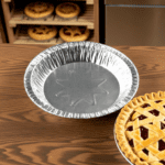 9″ x 1″ Medium Depth Foil Pie Pan next to pie