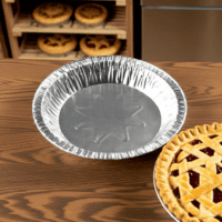 9″ x 1″ Medium Depth Foil Pie Pan next to pie
