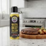 Wagyu Beef Tallow Cooking Spray next to cooked food