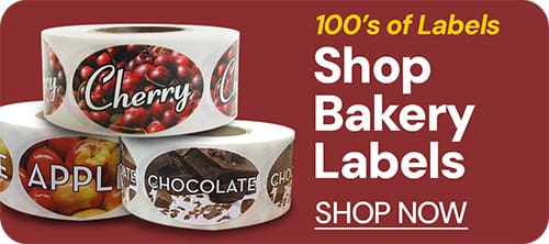 Shop bakery labels with rolls of bakery stickers stacked