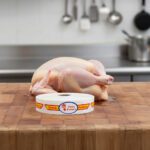 fresh poultry bilingual spanish and english strap label on butcher block