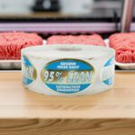 95 percent lean sticker on a gold foil oval butcher label