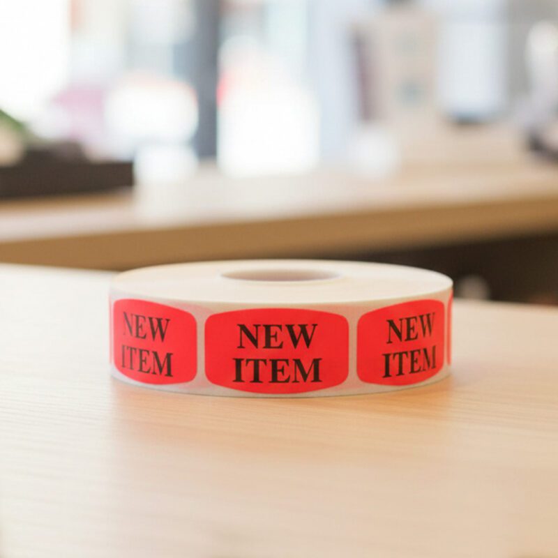 510065-New-Item-Label-Stickers new item sticker on a red label with black text