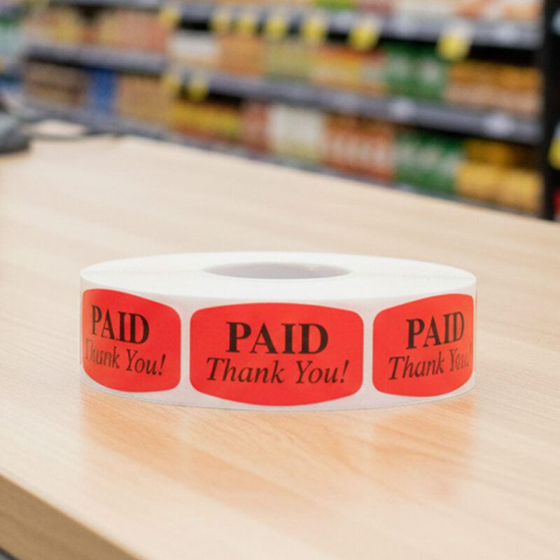 Paid thank you sticker on a red label with black print