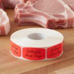 butterfly pork chops sticker on a red label with black print