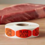 flank steak sticker on a red label with black print