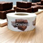 brownie label showing a brownie on a roll of stickers