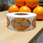 orange flavor sticker with oranges pictured on label