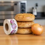 onion sticker next to some onion bagels