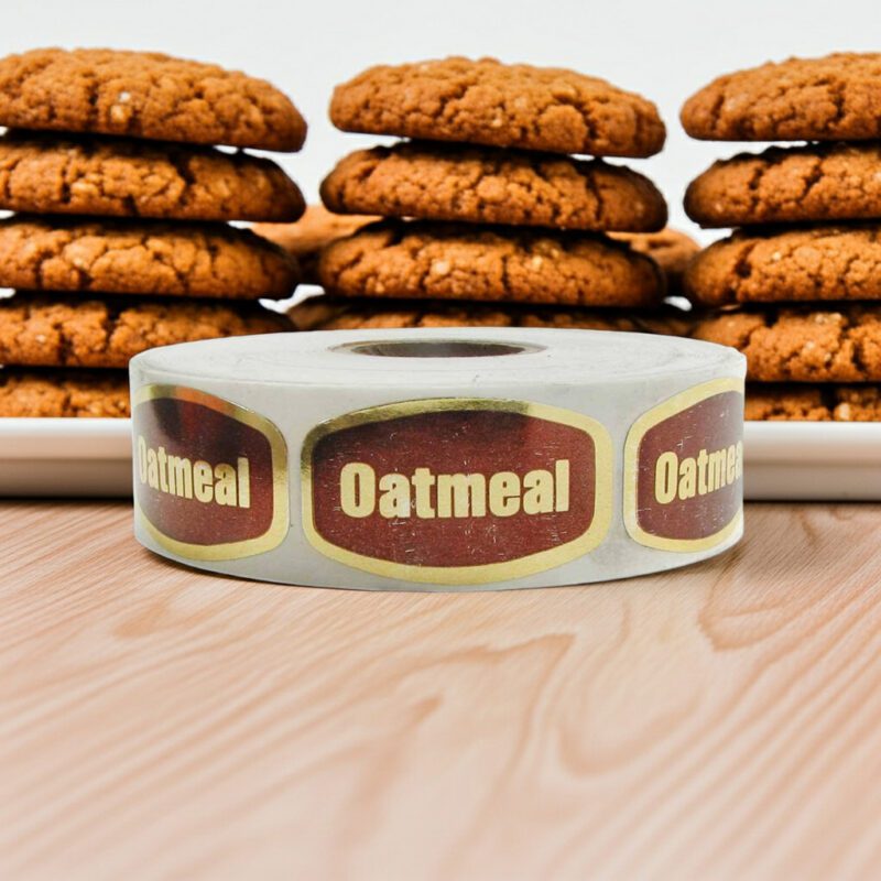 oatmeal label on a gold foil sticker with oatmeal cookies behind it
