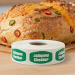 jalapeno cheddar label with green background and white text