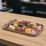 Charcuterie Board Sticker on a packaged charcuterie board showing meats and cheeses